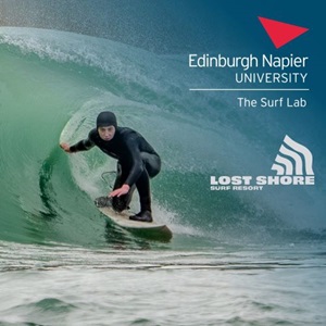 Surfer on a wave at Lost Shore Surf Resort