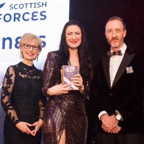 Fiona Forest-Anderson collecting award on stage