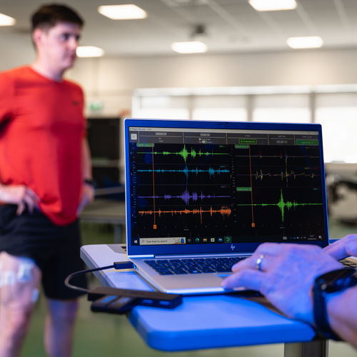 heart monitor screen with athlete in background