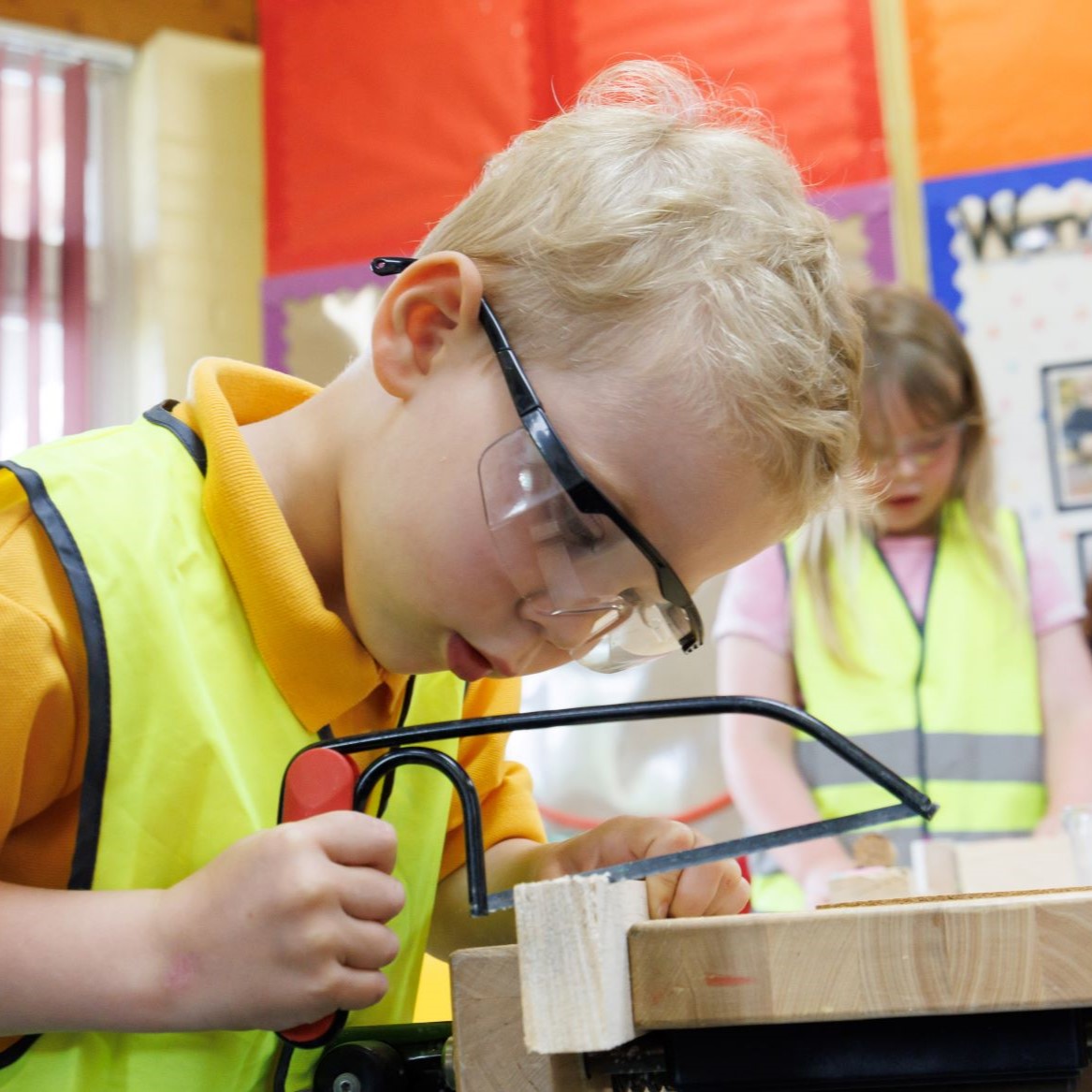 Young child playing with woodwork