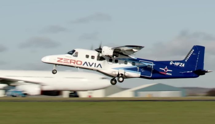 Smalll plane on runway taking off